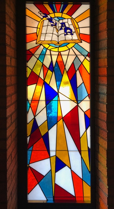 The Alpha and the Omega and the Word of God Written - one of the small stained glass windows at the United Presbyterian Church